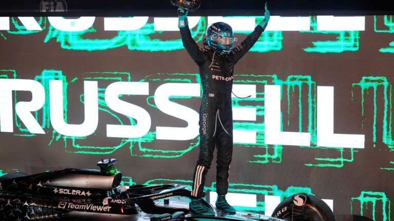 Mercedes driver George Russell of Britain celebrates after winning the Singapore Formula One Grand Prix at the Marina Bay Street Circuit in Singapore, Sunday, Oct. 5, 2025. (Vincent Thian/AP)