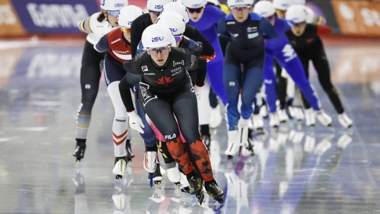 Canada's Ivanie Blondin, centre, leads the pack during the women's mass start competition at the ISU World Cup speed skating event in Calgary, Alta., Sunday, Nov. 23, 2025. (Jeff McIntosh/CP)