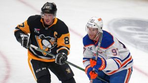 Pittsburgh Penguins' Sidney Crosby (87) defends against Edmonton Oilers' Connor McDavid during the first period of an NHL hockey game in Pittsburgh, Tuesday, Dec. 16, 2025. (Gene J. Puskar/AP)
