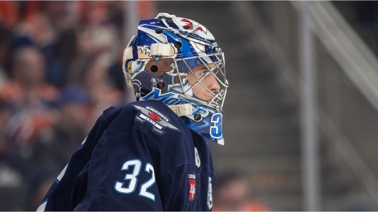 Winnipeg Jets goalie Thomas Milic (32) watches the play against the Edmonton Oilers during second period NHL action, in Edmonton on Saturday, December 6, 2025. (Jason Franson/CP)