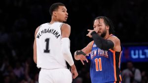 New York Knicks' Jalen Brunson (11), right, reacts after hitting a three-point shot past San Antonio Spurs' Victor Wembanyama during the second half of an NBA basketball game, Wednesday, Nov. 8, 2023, in New York. (Seth Wenig/AP)