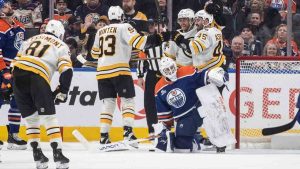 Boston Bruins celebrate a goal as Edmonton Oilers' goalie Connor Ingram (39) looks on during second period NHL action in Edmonton on Wednesday, December 31, 2025. (Jason Franson/CP)