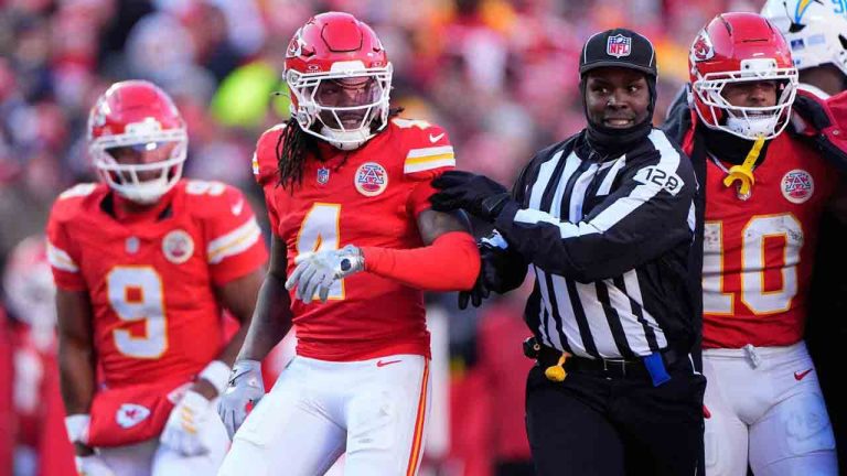 Kansas City Chiefs wide receiver Rashee Rice (4) is held back by an official during the second half of an NFL football game against the Los Angeles Chargers Sunday, Dec. 14, 2025, in Kansas City, Mo. (Charlie Riedel/AP)