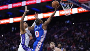 Philadelphia 76ers' Tyrese Maxey, right, goes up for a shot against Sacramento Kings' Dylan Cardwell during the second half of an NBA basketball game Thursday, Jan. 29, 2026, in Philadelphia. (AP Photo/Matt Slocum)