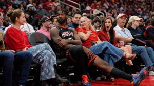 Houston Rockets forward Tari Eason (17) sits with fans during an extended officials timeout in the first half of an NBA basketball game against the Phoenix Suns Monday, Jan. 5, 2026, in Houston. (David J. Phillip/AP)