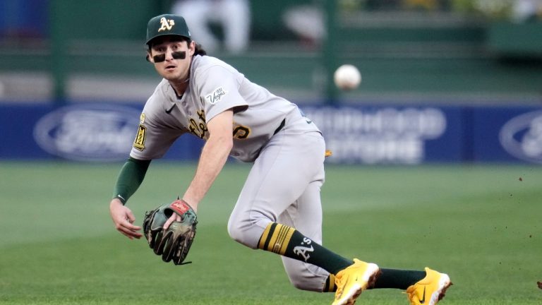 Athletics shortstop Jacob Wilson dives by can't reach a ball hit for a single by Pittsburgh Pirates' Andrew McCutchen during the first inning of a baseball game in Pittsburgh, Friday, Sept. 19, 2025. (Gene J. Puskar/AP)