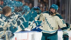 Seattle Torrent winger Julia Gosling celebrates with teammates after scoring the first goal in franchise history against Vancouver on Nov. 21, 2025. (Photo by Ethan Cairns/CP)