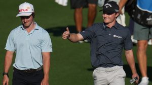 Blades Brown, right, reacts for a cheering gallery as he walks with David Ford as the gallery cheers for Brown who finished with a 12-under-par 60 during the second round of the American Express golf event at the Jack Nicklaus Tournament Course at PGA West Friday, Jan. 23, 2026, in La Quinta, Calif. (Ross D. Franklin/AP)