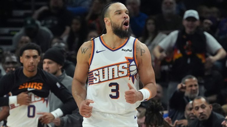 Phoenix Suns forward Dillon Brooks celebrates a made 3-pointer against the Detroit Pistons during the first half of an NBA basketball game Thursday, Jan. 29, 2026, in Phoenix. (AP Photo/Ross D. Franklin)