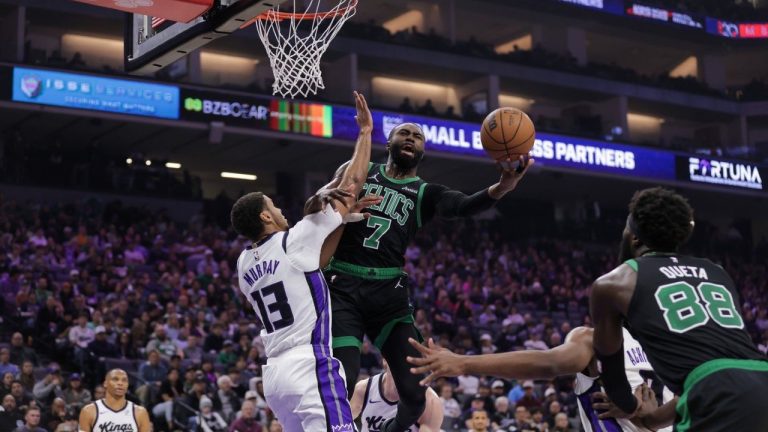 Boston Celtics guard Jaylen Brown attempts a layup over Sacramento Kings forward Keegan Murray during the first half of an NBA game Thursday, Jan. 1, 2026, in Sacramento, Calif. (AP/Scott Marshall)