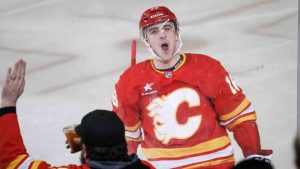 Calgary Flames' Morgan Frost celebrates his goal during second period NHL hockey action against the Seattle Kraken in Calgary on Saturday, Feb. 8, 2025. (Jeff McIntosh/CP)