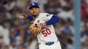 Los Angeles Dodgers' Mookie Betts throws out Toronto Blue Jays' Isiah Kiner-Falefa during the seventh inning in Game 4 of baseball's World Series, Tuesday, Oct. 28, 2025, in Los Angeles. (Ashley Landis/AP)