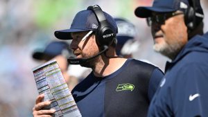 Seattle Seahawks offensive coordinator Klint Kubiak, center, works on the sideline during the first half of an NFL football game against the Jacksonville Jaguars, Sunday, Oct. 12, 2025, in Jacksonville, Fla. (AP Photo/Phelan M. Ebenhack)