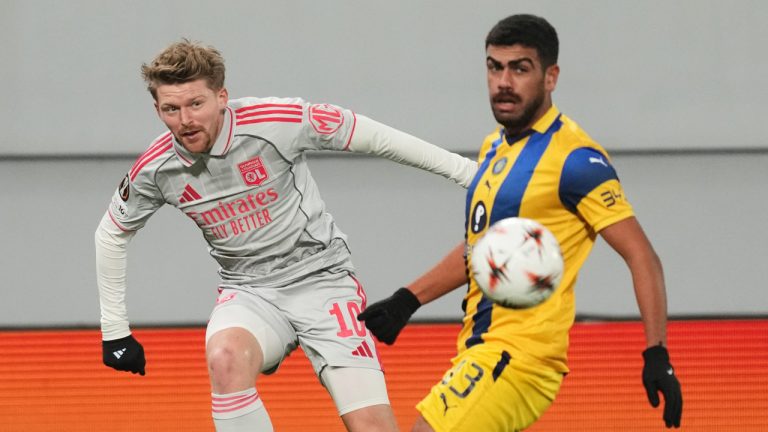 Maccabi Tel Aviv's Raz Shlomo tries to block a shot from Lyon's Pavel Sulc during the Europa League opening phase match between Maccabi Tel Aviv and Lyon, in Backa Topola, Serbia, Thursday, Nov. 27, 2025. (Darko Vojinovic/AP)