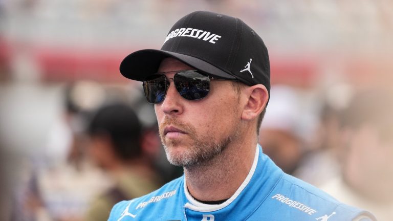 FILE - Denny Hamlin looks on prior to a NASCAR Cup Series auto race at Charlotte Motor Speedway, Sunday, Oct. 5, 2025, in Concord, N.C. (AP Photo/Matt Kelley, File)