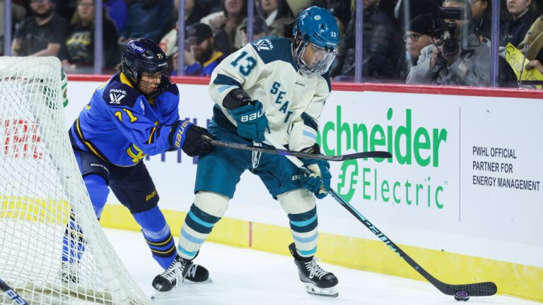 Seattle Torrent's Mikyla Grant-Mentis carries the puck with pressure from Toronto Sceptres' Anna Kjellbin during first period PWHL action in Hamilton, Ont., on Saturday, Jan. 3, 2026. (Nick Iwanyshyn/CP)