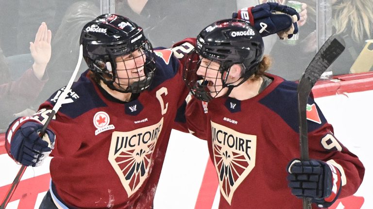 Montreal Victoire's Marie-Philip Poulin (29) celebrates with teammate Maggie Flaherty (91) after scoring against the Minnesota Frost during third period PWHL hockey action in Laval, Que., Sunday, Jan. 4, 2026. THE CANADIAN PRESS/Graham Hughes
