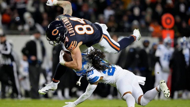 Chicago Bears tight end Colston Loveland (84) is tackled by Detroit Lions cornerback Avonte Maddox (29) during the second half of an NFL football game, Sunday, Jan. 4, 2026, in Chicago. (AP Photo/Nam Y. Huh)