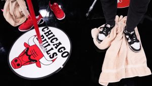 United Center employees try to dry the court before an NBA game between the Miami Heat and the Chicago Bulls in Chicago, Thursday, Jan. 8, 2026. (Nam Y. Huh/AP)