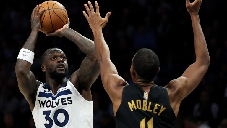 Minnesota Timberwolves forward Julius Randle, shoots over Cleveland Cavaliers' Evan Mobley during the second half of an NBA game, Thursday, Jan. 8, 2026, in Minneapolis. (Matt Krohn/AP)