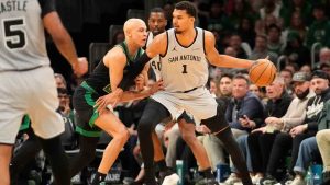 San Antonio Spurs forward Victor Wembanyama (1) is guarded by Boston Celtics guard Jordan Walsh (27) during the first half of an NBA basketball game Saturday, Jan. 10, 2026, in Boston. (Robert F. Bukaty/AP)
