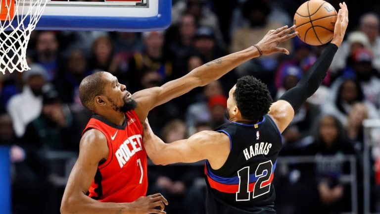 Houston Rockets forward Kevin Durant, left, defends against a shot by Detroit Pistons forward Tobias Harris (12) during the second half of an NBA basketball game Friday, Jan. 23, 2026, in Detroit. (AP Photo/Duane Burleson)