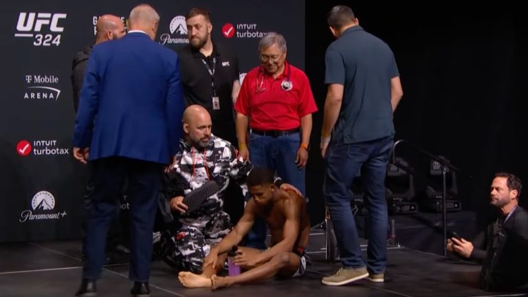 UFC bantamweight Cameron Smotherman seen recovering after passing out at the UFC 324 official weigh-in. (YouTube/UFC)