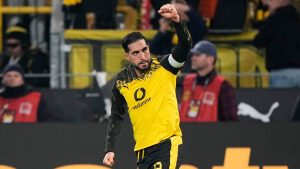 Dortmund's Emre Can celebrates after he scored his side's decisive third goal from the penalty spot during the German Bundesliga soccer match between Borussia Dortmund and St. Pauli in Dortmund, Germany, Saturday, Jan. 17, 2026. (Martin Meissner/AP)