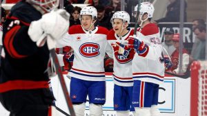 Montréal Canadiens' Oliver Kapanen (91), Ivan Demidov, center, and Noah Dobson (53) celebrate a goal by Sammy Blais, not shown, against the Carolina Hurricanes during the first period of an NHL hockey game in Raleigh, N.C., Thursday, Jan. 1, 2026. (Karl DeBlaker/AP)