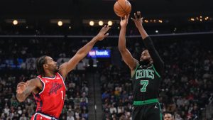 Boston Celtics guard Jaylen Brown, right, shoots a as Los Angeles Clippers forward Kawhi Leonard defends during the first half of an NBA basketball game Saturday, Jan. 3, 2026, in Inglewood, Calif. (AP Photo/Mark J. Terrill)