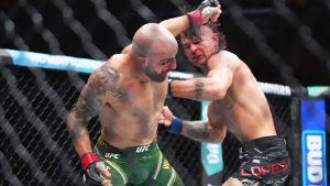 Alexander Volkanovski, left, and Diego Lopes, right, battle during a mixed martial arts title fight at UFC 314 in Miami. (Lynne Sladky/AP)