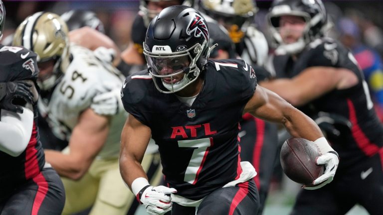 Atlanta Falcons running back Bijan Robinson (7) carries against the New Orleans Saints in the first half of an NFL football game, Sunday, Jan. 4, 2026, in Atlanta. (AP Photo/Brynn Anderson)