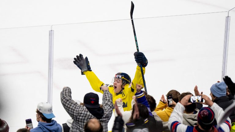 Sweden's Anton Frondell (16) celebrates after scoring on Finland goaltender Petteri Rimpinen (30) during semifinal IIHF World Junior Hockey Championship action in St. Paul, Minn., on Sunday, January 4, 2026. (Christopher Katsarov/CP)