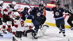 Winnipeg Jets' Gabriel Vilardi celebrates his goal against the New Jersey Devils with teammates during second period NHL action in Winnipeg on Sunday January 11, 2026. (THE CANADIAN PRESS/Fred Greenslade)
