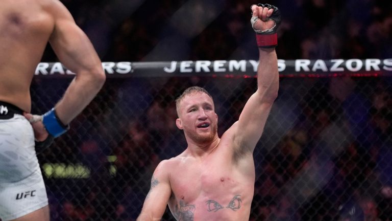 Justin Gaethje celebrates after defeating Rafael Fiziev during a UFC 313 mixed martial arts lightweight bout Saturday, March 8, 2025, in Las Vegas. (John Locher/AP)