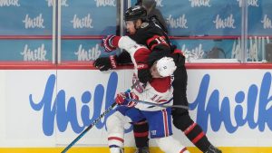 Ottawa Senators right wing Drake Batherson (19) battles with Montreal Canadiens right wing Brendan Gallagher (11) along the boards during first period NHL action, in Ottawa, Saturday, Jan. 17, 2026. (Adrian Wyld/CP)