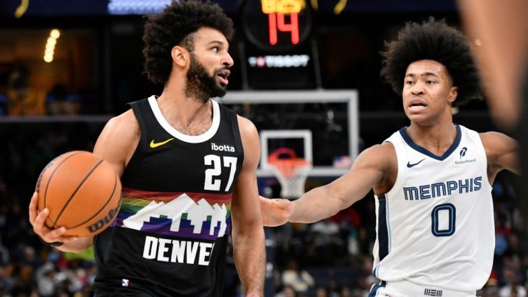 Denver Nuggets guard Jamal Murray handles the ball against Memphis Grizzlies forward Jaylen Wells in the second half of an NBA game Monday, Nov. 24, 2025, in Memphis, Tenn. (AP/Brandon Dill)
