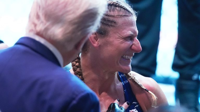 President Donald Trump congratulates Kayla Harrison after winning her women's bantamweight championship bout against Julianna Pena at UFC-316. (Manuel Ceneta/AP)