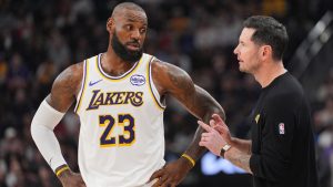 Los Angeles Lakers forward Lebron James (23) talks with head coach JJ Redick during the first half of an NBA basketball game against the Los Angeles Clippers Saturday, Dec. 20, 2025, in Inglewood, Calif. (Jae C. Hong/AP)