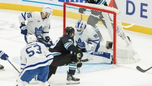Utah Mammoth centre Liam O'Brien (38) shoots the puck against Toronto Maple Leafs goalie Dennis Hildeby (35) during the third period of an NHL hockey game Tuesday, Jan. 13, 2026, in Salt Lake City. (Melissa Majchrzak/AP)