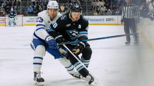 Utah Mammoth defenceman Mikhail Sergachev (98) fights for the puck against Toronto Maple Leafs left wing Matthew Knies (23) during the first period of an NHL hockey game Tuesday, Jan. 13, 2026, in Salt Lake City. (Melissa Majchrzak/AP)