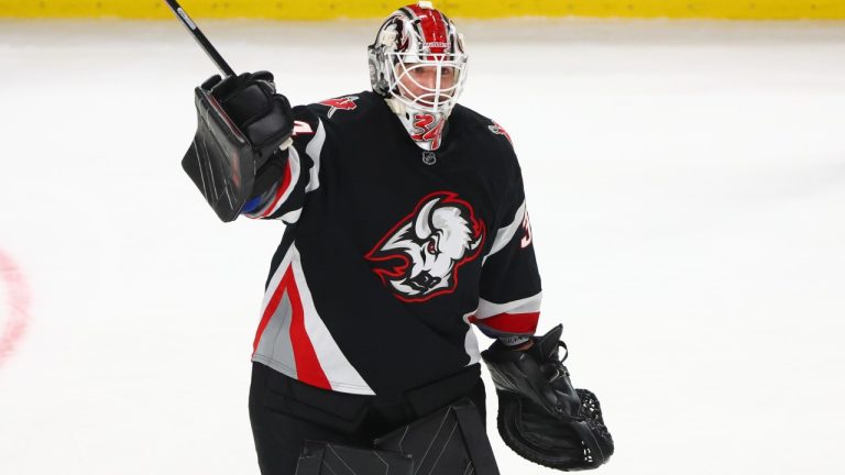 Buffalo Sabres goaltender Alex Lyon (34) celebrates after a victory in an NHL hockey game against the Los Angeles Kings, Thursday, Jan. 29, 2026, in Buffalo, N.Y. (Jeffrey T. Barnes/AP)