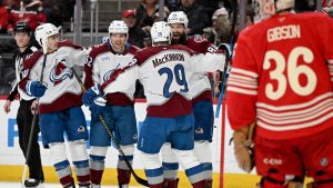 Colorado defenseman Brent Burns (84) celebrates with Colorado defenseman Sam Malinski (70), Colorado left wing Artturi Lehkonen (62) and Colorado center Nathan MacKinnon (29) after scoring a goal against Detroit in the first period of an NHL hockey game Saturday, Jan. 31, 2026 in Detroit. (Lon Horwedel/AP)