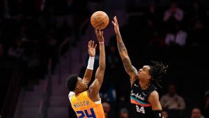 Charlotte Hornets forward Brandon Miller, left, shoots against San Antonio Spurs guard Devin Vassell during the first half of an NBA basketball game in Charlotte, N.C., Saturday, Jan. 31, 2026. (Nell Redmond/AP)