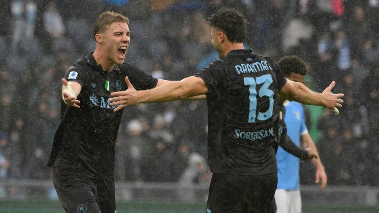 Napoli's Amir Rrahmani, right, celebrates with teammate Rasmus Hojlund after scoring during the Italian Serie A soccer match between SS Lazio and SSC Napoli in Rome, Sunday, Jan. 4, 2026. (Fabrizio Corradetti/LaPresse via AP)