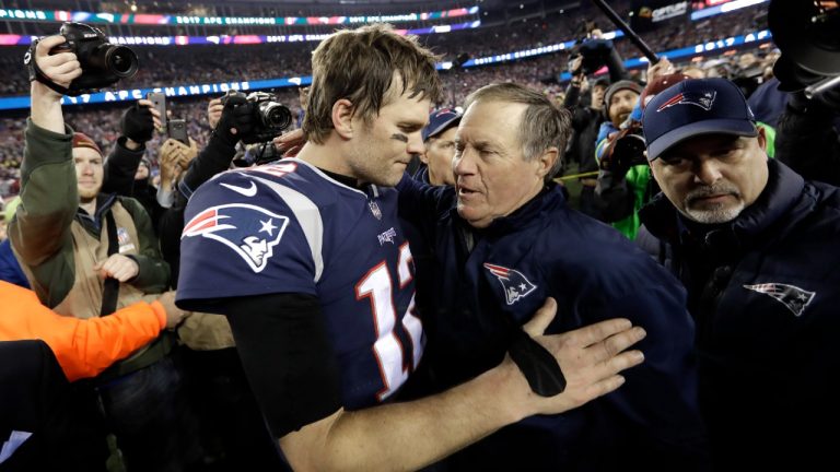 New England Patriots quarterback Tom Brady, left, hugs coach Bill Belichick after the 2018 AFC championship game against the Jacksonville Jaguars. (David J. Phillip/AP)