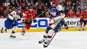 Edmonton Oilers right wing Kasperi Kapanen (42) moves the puck during the first period of an NHL hockey game against the Chicago Blackhawks, Monday, Jan. 12, 2025, in Chicago. (Matt Marton/AP)