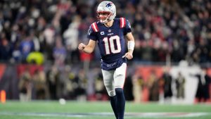 New England Patriots quarterback Drake Maye celebrates as running back Rhamondre Stevenson runs for a touchdown during the second half of an NFL football game against the Miami Dolphins in Foxborough, Mass., Sunday, Jan. 4, 2026. (Charles Krupa/AP)