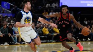 Toronto Raptors guard Immanuel Quickley (5) moves the ball while defended by Golden State Warriors guard Pat Spencer (61) during the second half of an NBA basketball game, Tuesday, Jan. 20, 2026, in San Francisco. (Godofredo A. Vásquez/AP)