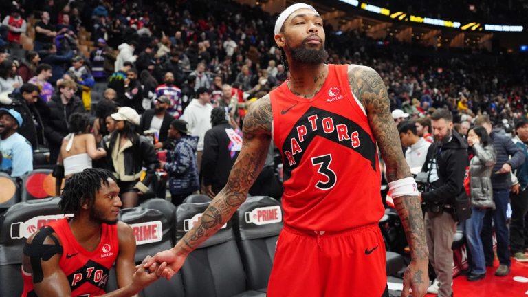 Toronto Raptors forward Brandon Ingram (3) and teammate Immanuel Quickley (5) react after Ingram's basket against the Denver Nuggets was ruled that it came after the game clock sounded in NBA action in Toronto on Wednesday December 31, 2025. (Frank Gunn/CP)